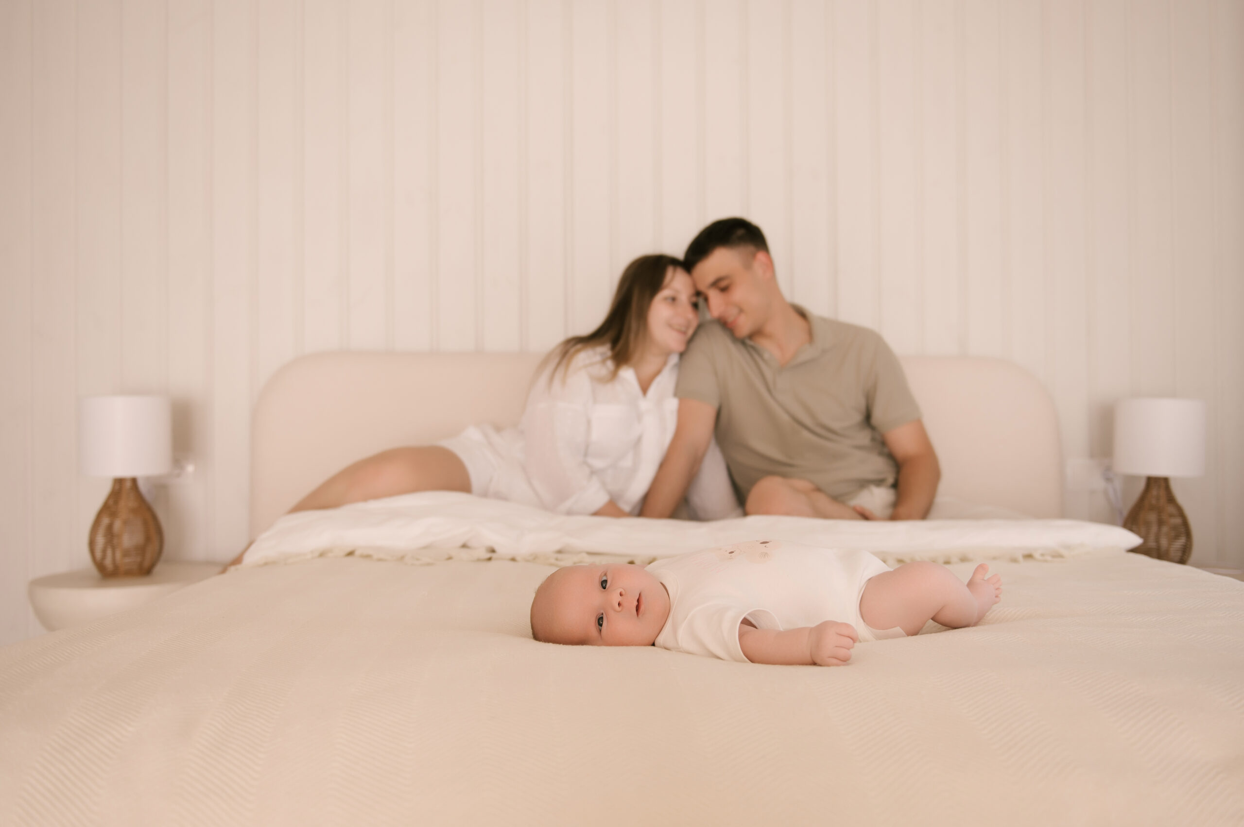 Illustration of a couple holding their newborn baby, with emotional distance between them, symbolizing the challenges of postpartum intimacy.